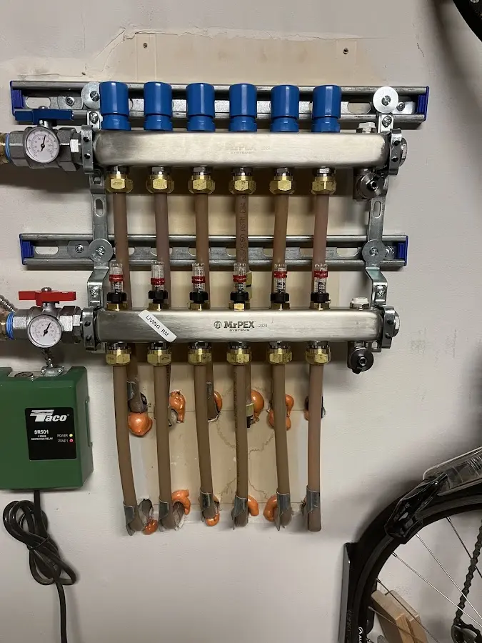 Plumber performing Water Heater Repair at a residential property in Frederick